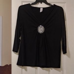 Black jersey with silver jeweled emblem